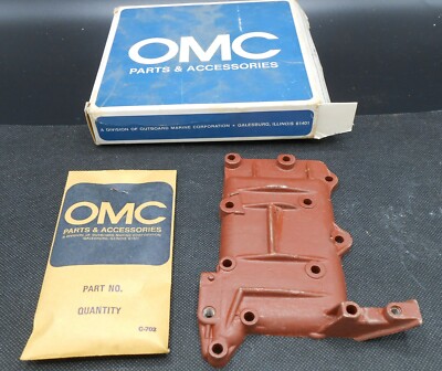 384749 OMC Exhaust cover with screws, new from older stock in original box