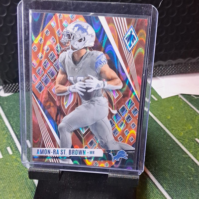 2023 Panini Phoenix Amon-Ra St. Brown Detroit Lions #64 Orange 43/99