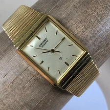 Vintage Orient Mens Tank Gold Tone Rectangular Quartz 25mm Watch 7 1/2"