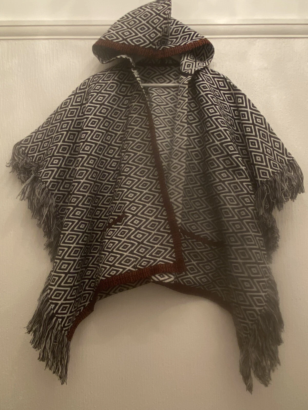 BLACK WHITE CAPE PONCHO FRINGE HOODED 10-14 PARTY WINTER TOWIE BOHO XMAS SMART
Opens in a new window