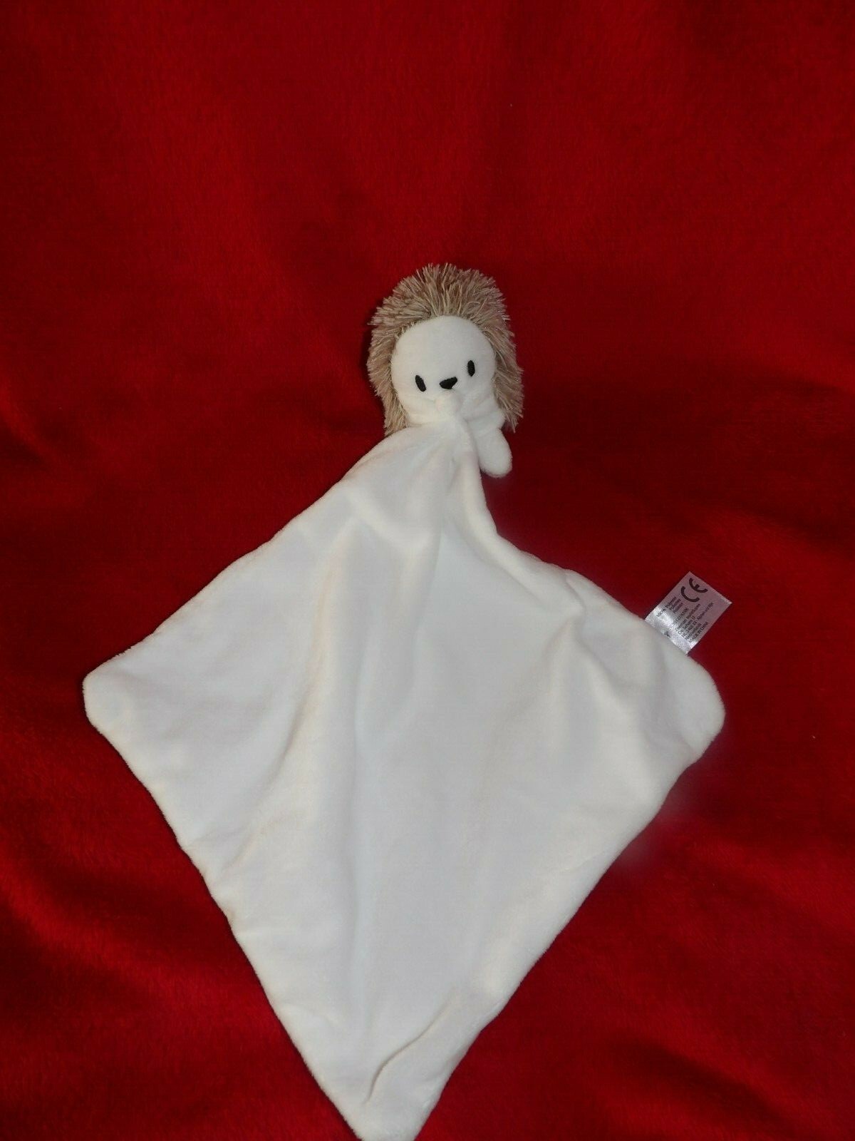 Doudou grelot hérisson beige mouchoir blanc Zeeman pour bébé