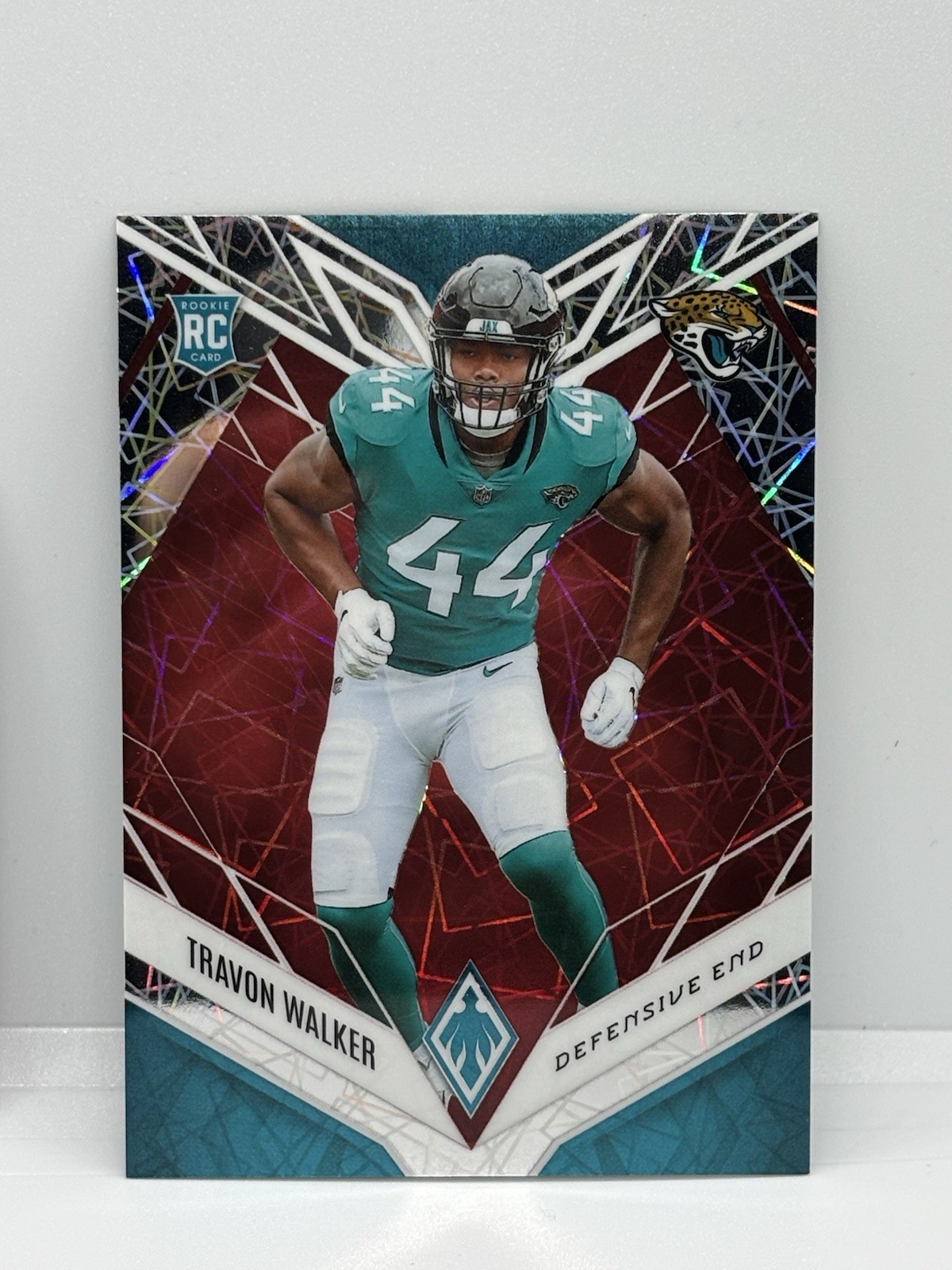 2022 Panini Phoenix - Rookies Red Lazer #125 Travon Walker /150 (RC)