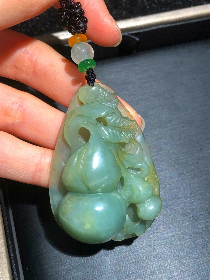 Hand carved jade on sale pendant