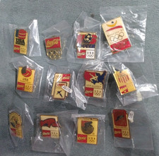 12 different Coca Cola Olympic pins