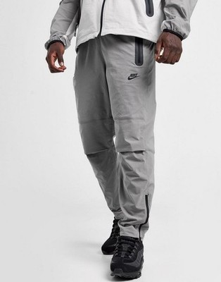 Nike Tech Pack Woven Trousers Tapered Stretch Sport Pants HM8241-014 Grau Gr. S