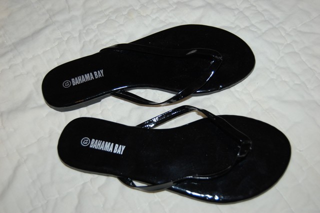 shiny black flip flops