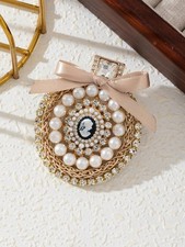 Broche camafeo vintage rosa rubor perla cristal lazo tono dorado joyería elegante