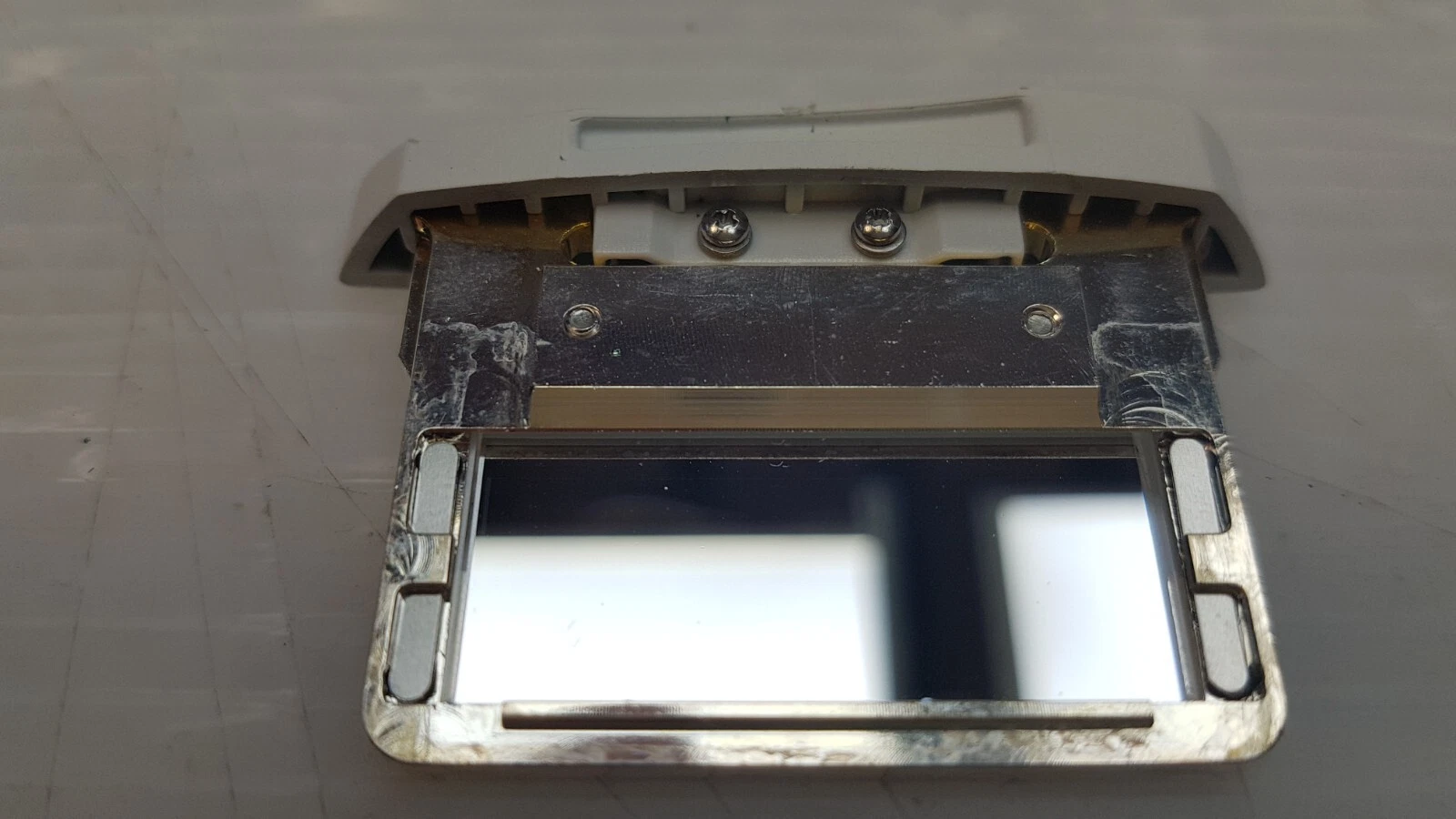 Metal frame of the LB-003889 filter cartridge with the reflective filter window