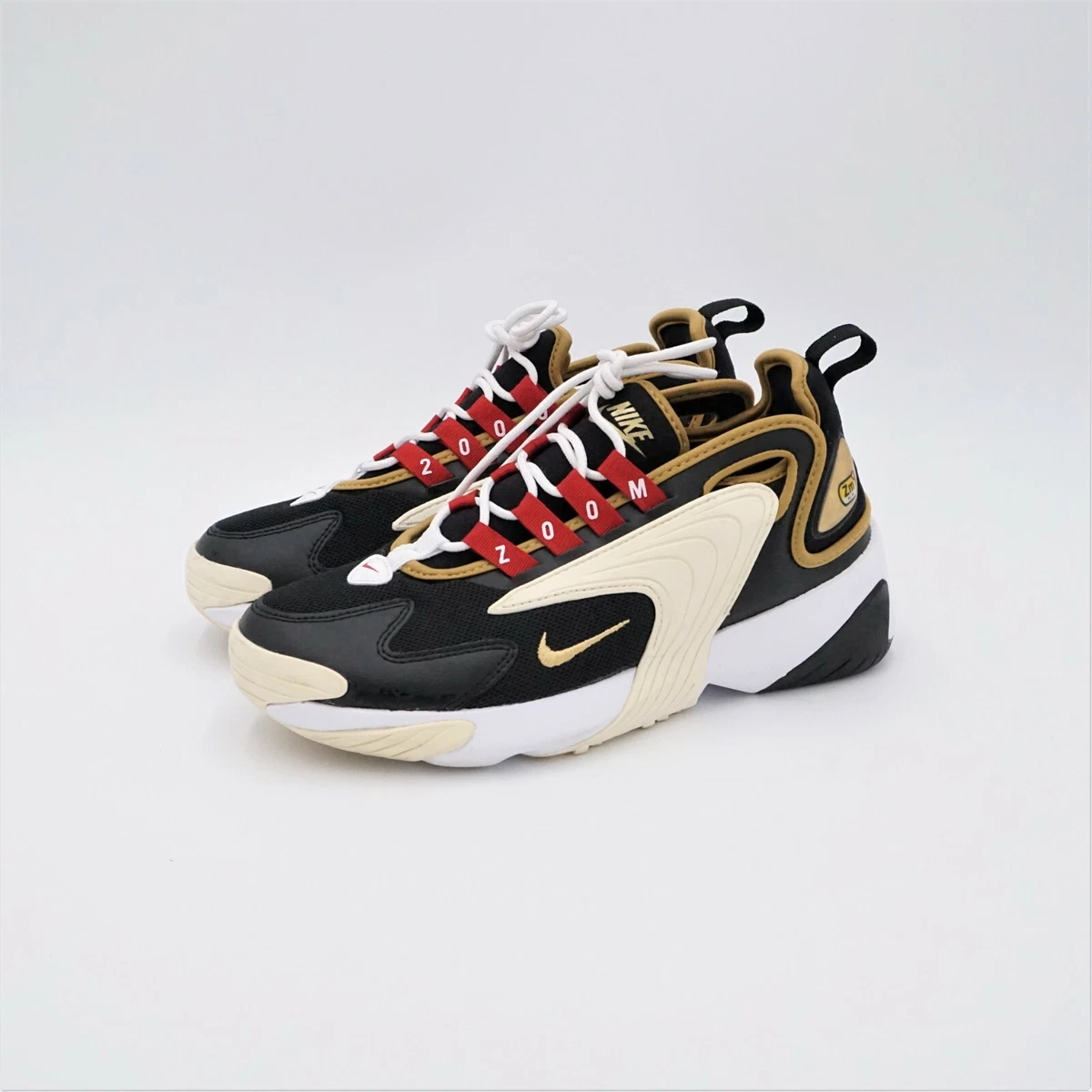 Nike zoom 2k trainers in black and gold sale