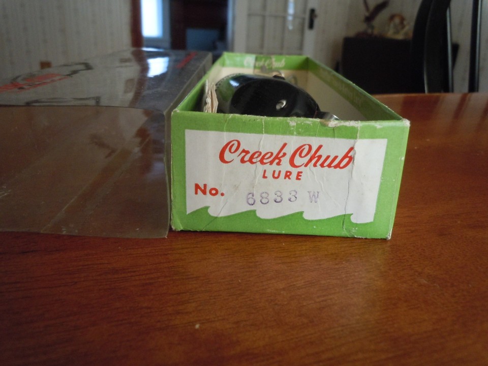 Three Creek Chub dingbat fishing lures in boxes sold at auction on 11th