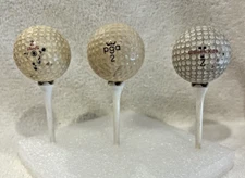 3 vintage golf balls: PGA Ryder Cup II Red Crown, Wilson K-28, Maxfli