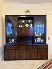 Vintage dark wood display cabinet.