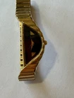 Vintage 1980s Seiko Rivoli Half Moon Watch: Gold Tone, Black Dial, Asymmetric