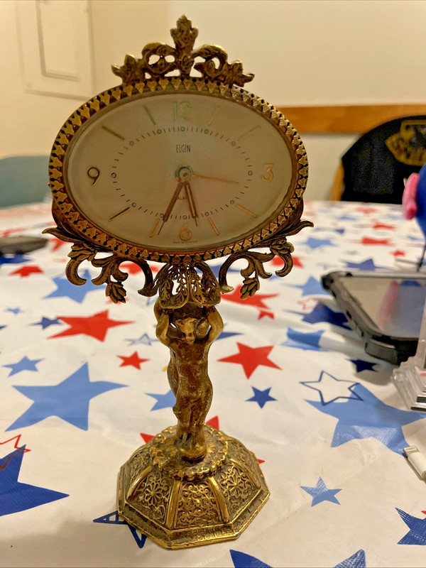 Elgin Cherub Atlas Oval Clock Vintage in good working condition