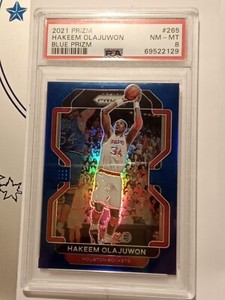 2021-22 Panini Prizm #265 Hakeem Olajuwon Blue Prizm 199/199 Houston Rockets