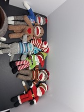 sock monkey lot. 7 sock monkey and 1 sock monkey basket. All still have tags.