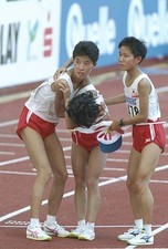Junko Asari Akemi Matsono Tomoe Abe of Japan hold each other up af- Old Photo
