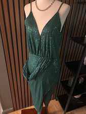 Prettylittlething sleeveless cocktail mini dress features a plunging V-neckline