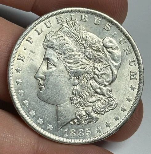 AU 1885-O Morgan Silver Dollar (small obv scratch) U.S. $1 Coin Almost UNC
