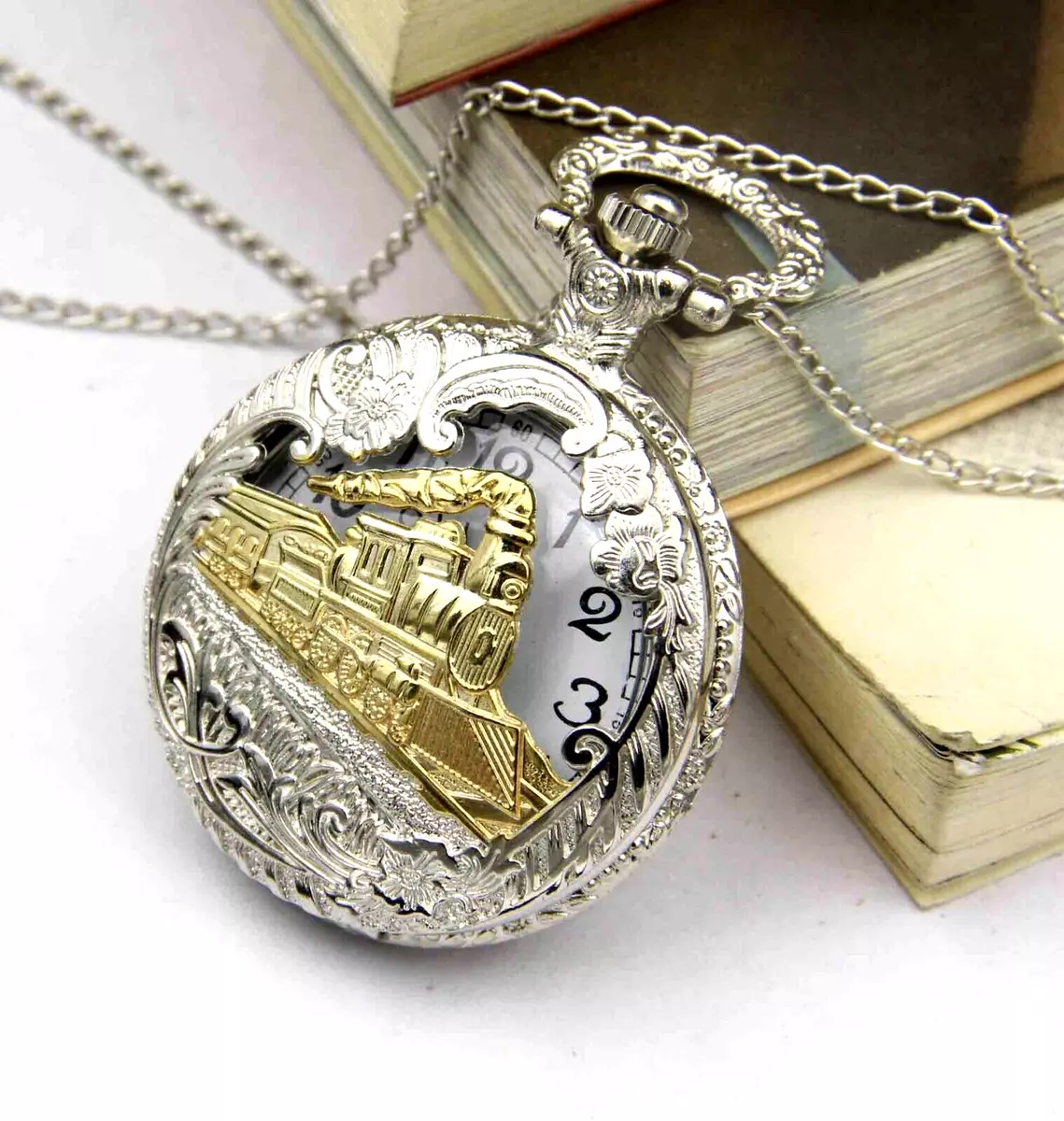 Silver pocket watch with gold best sale train