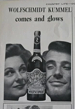 1958 Bottle Wolfschmidt Kummel Comes and glows vintage  ad