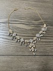Gold necklace with silver rhinestones and leaf-shaped charms #glamour #statement — photo 1