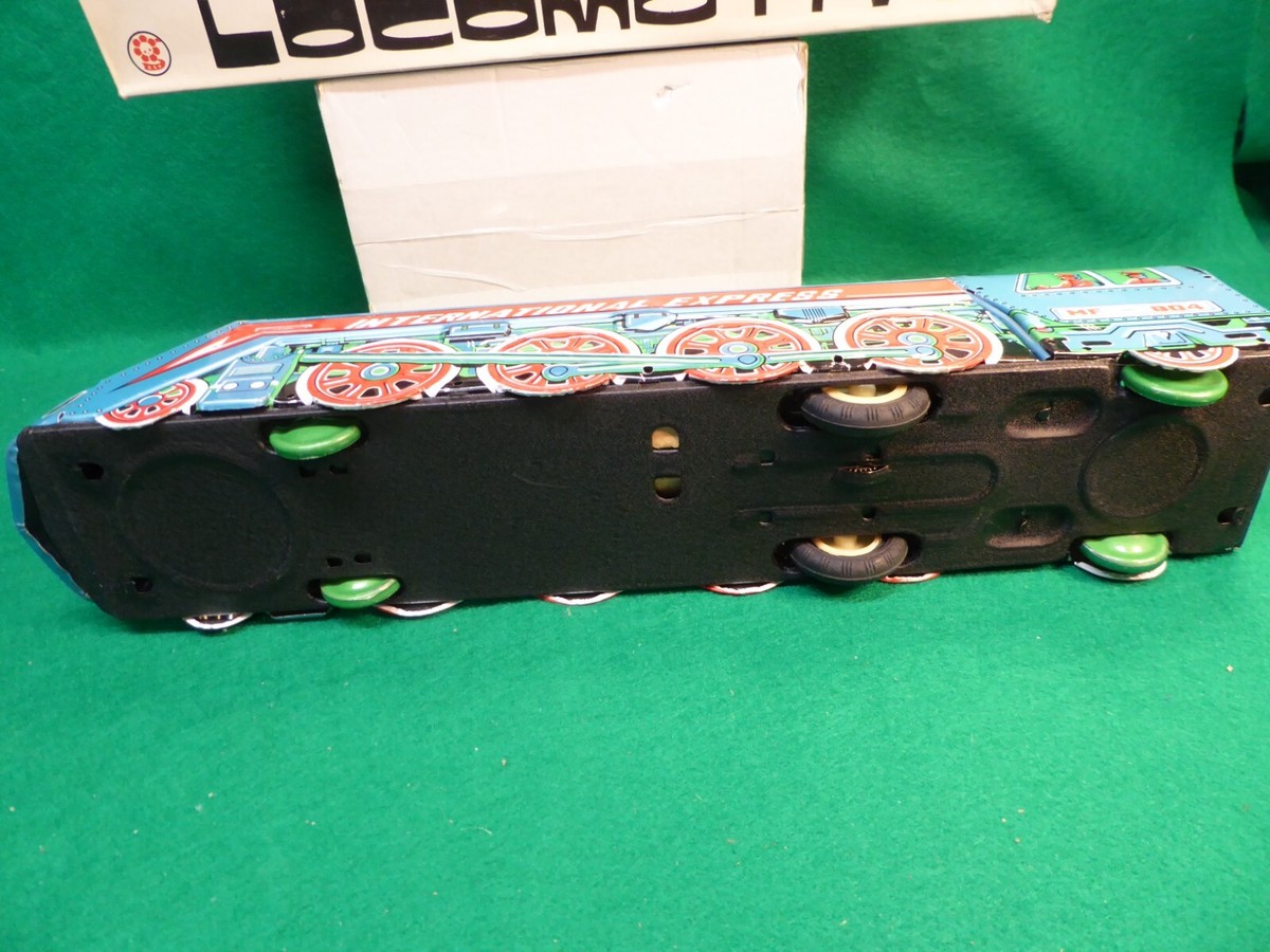 Locomotive Jouet Friction International Express MF-804 – Tôle Lithographiée Ancienne