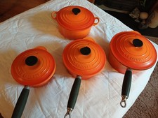 Le Cruset Orange Saucepans with Lids Set of 3 Plus Casserole Dish.  Used