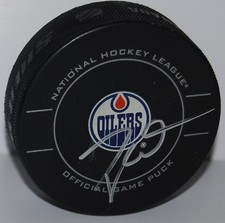 TAYLOR HALL signed (EDMONTON OILERS) Official game hockey puck W/COA #2