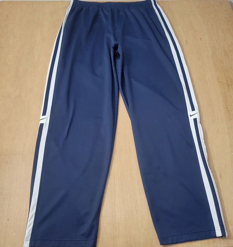 Pantalones deportivos Nike azules talla XL para hombre etiqueta plateada logotipo Swoosh cremallera inferior defecto🚨 Foto 2 de 4