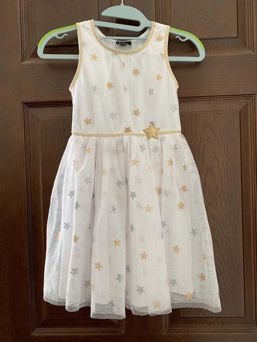 white dress with gold stars Showstopping Celestial Dresses With Stars and Moons