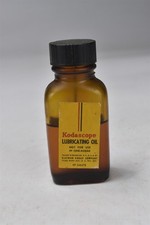 KODASCOPE LUBRICATING OIL BROWN BOTTLE 1/4 TO 1/2 FULL 07918