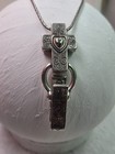 2This is a Brighton cross pendant and chain lanyard, often used as an ID badge — photo 1
