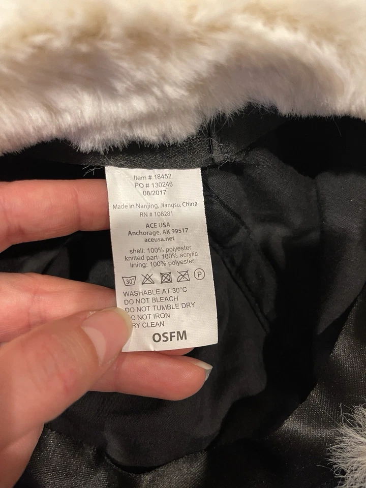 knitted winter hat with a visor and white faux fur ear muffs and pom-pom New - Image 4 of 4