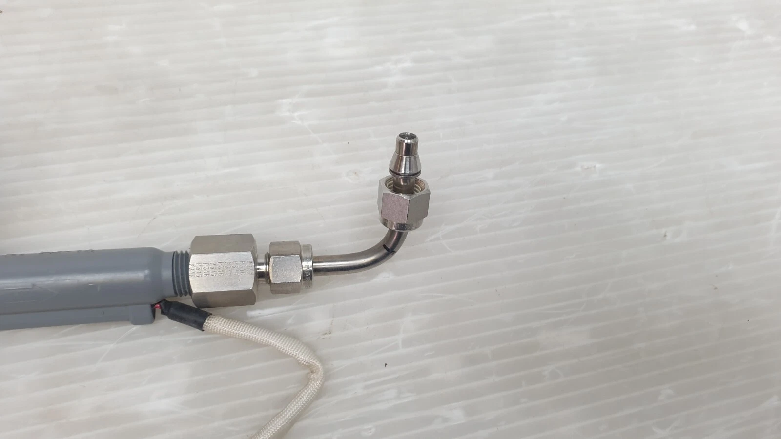 Stainless steel 90 degree tube elbow and compression fitting on the Dwyer P2-15