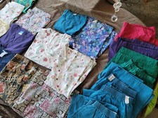 13 small and medium scrub tops and 6 pants