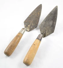 Two Unbranded Eleven Inch Wood Handle Flat Concrete Masonry Trowels