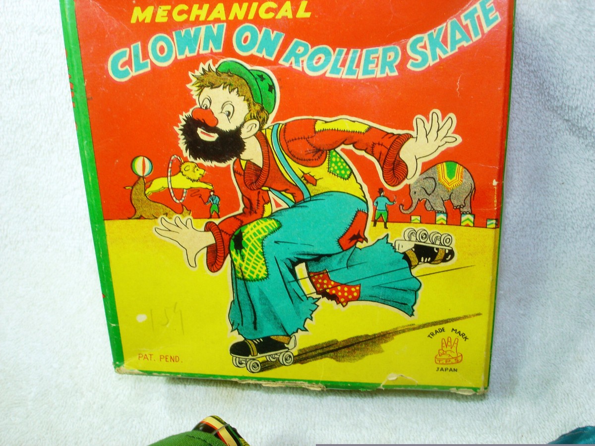 2 VINTAGE 1950s WIND UP CLOWNS ON ROLLER SKATES 1 IN