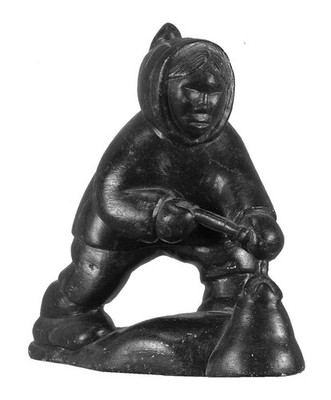 Vintage Inuit Soapstone Carving of an Eskimo Pulling a Seal Out from the Ice