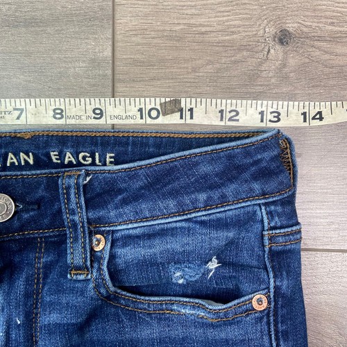 Pantalones de mezclilla ajustados elásticos American Eagle Next Level 2 dobladillo crudo desgastado azul - Imagen 7 de 10