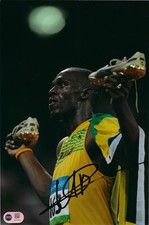 USAIN BOLT SIGNED 12x8 OLYMPICS LEGEND JAMAICA 9.58 PHOTO (ACG CERT AG16767)