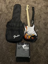 Squire By Fender Stratocaster Electric Guitar With Amp And More Accessories.