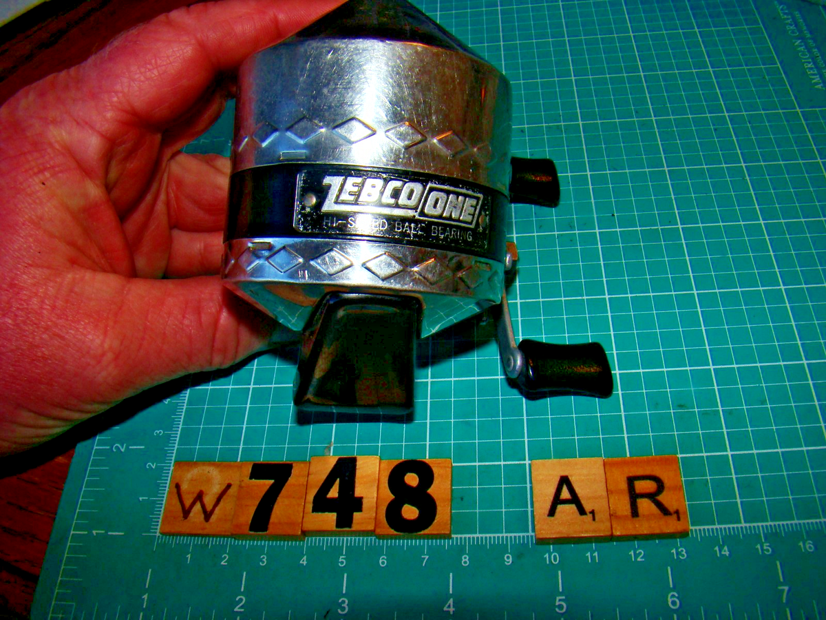 W0748 AR ZEBCO ONE DIAMOND PATTERN MADE IN USA SPINCAST FISHING