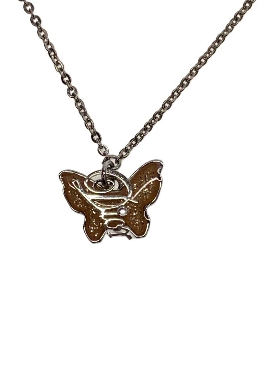 Collier Christian Dior    Haut avec femme