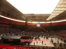 PHOTO WEMBLEY: THE STADIUM IN CONCERT SETUP LOOKING WESTWARDS ON A VERY SUNNY E