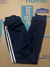 Navy blue Adidas joggers with white stripes. Women size medium