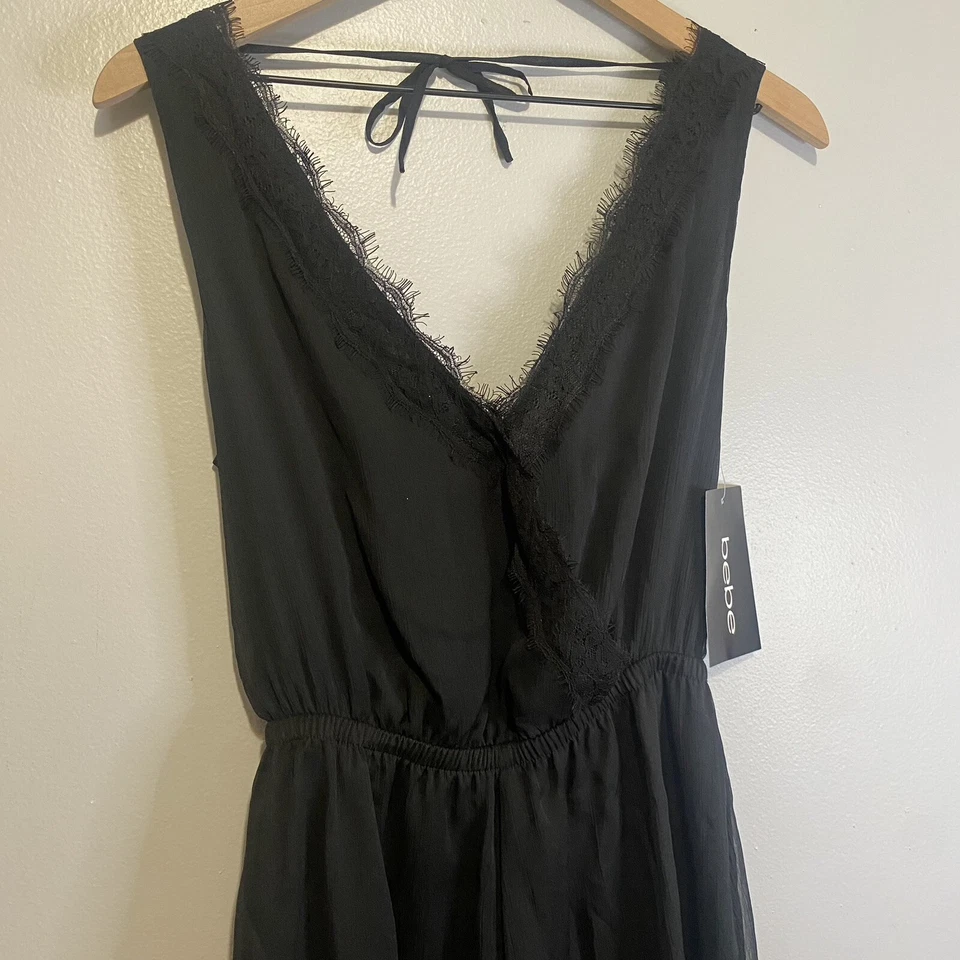 Mameluco Bebe nuevo con etiquetas sin mangas con ribete de encaje talla pequeña negro cintura elástica Foto 2 de 4