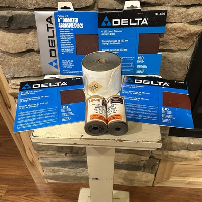 Delta 6 inch diameter, abrasive disc and miscellaneous sandpaper rolls.