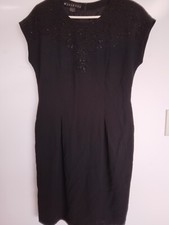 Size 12 Black lined dress w/bead work on chest. Excellent condition
