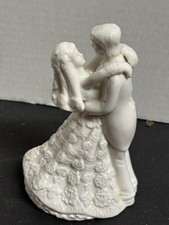 K's Collection Bride and groom wedding cake topper couple embrace for 1st dance